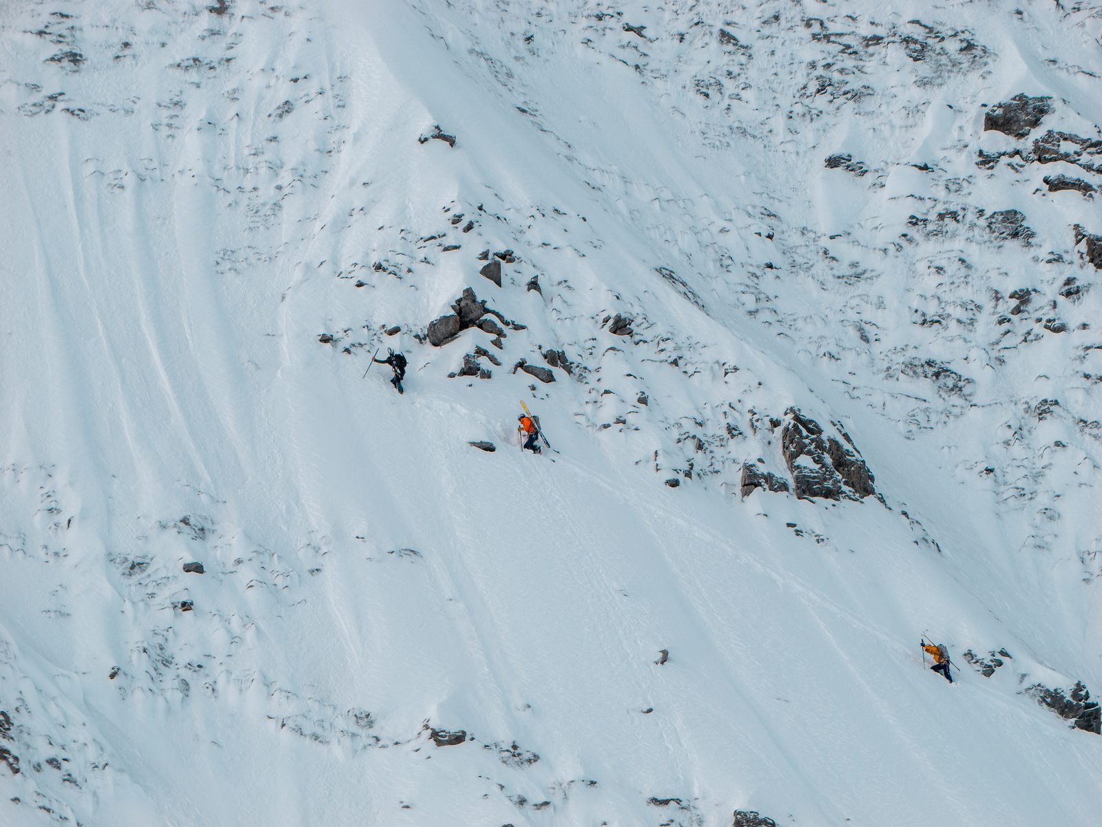 A skier deep in a couloir of the Écrins
