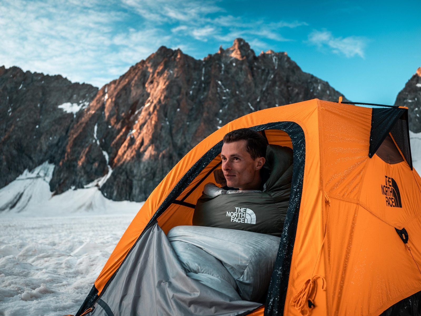 Sunrise from the tent, glacier and ridge behind