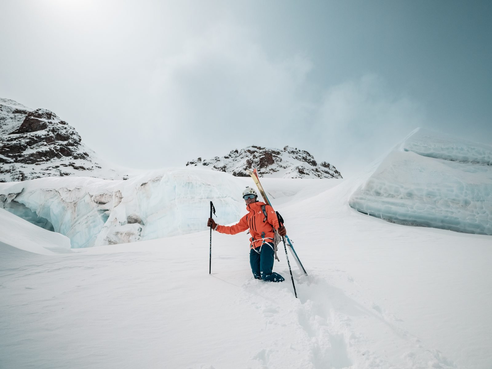 A skier at the foot of a serac