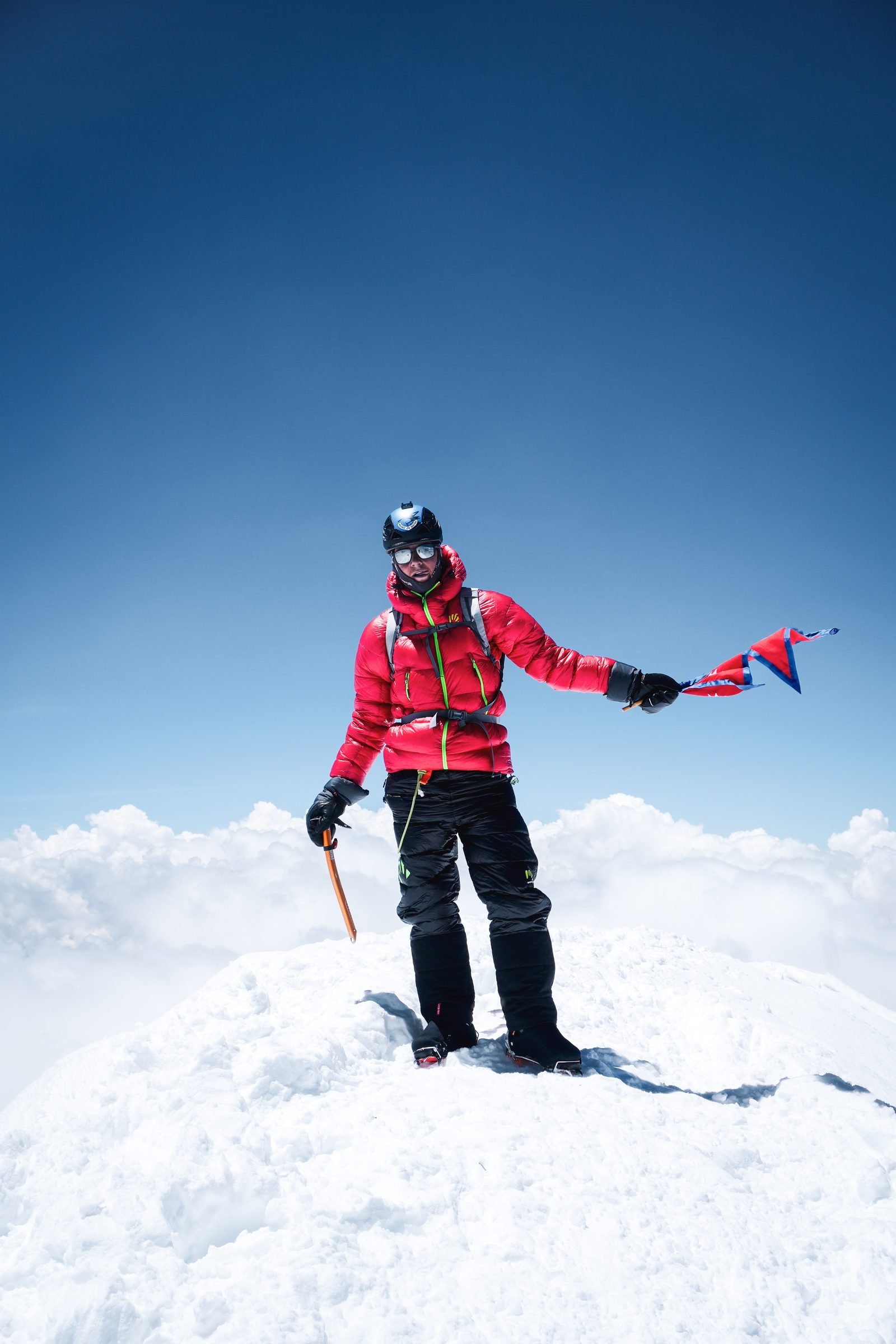 A climber alone on the summit