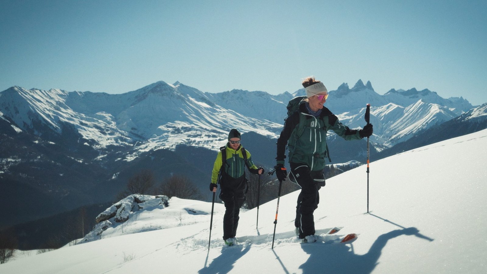 Aurélia Lanoë and Barthélémy Fendt ski touring up a snow slope in the Grandes Rousses, Millet - My First Ski Summit